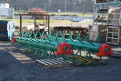 Acumen Machine green forestry mill part after repairs