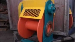 Acumen Machine orange and yellow cage outdoors