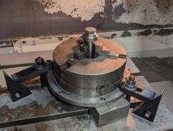 Acumen repairs steel part in vise with notches in top